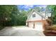 Spacious two-car garage with brick exterior and a wide driveway at 12037 Deer Run, Raleigh, NC 27614