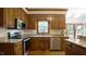 Well-equipped kitchen featuring stainless appliances and granite countertops at 12037 Deer Run, Raleigh, NC 27614