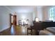 Elegant living room featuring a piano, hardwood floors, and classic decor at 12037 Deer Run, Raleigh, NC 27614