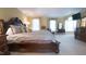 Spacious primary bedroom featuring a bed, dresser, and large windows at 12037 Deer Run, Raleigh, NC 27614