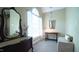 Bright sitting room featuring a large window, hardwood floors, and stylish decor at 12037 Deer Run, Raleigh, NC 27614