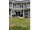 Backyard featuring an outdoor dining area and manicured lawn at 121 Longleaf Pine St, Clayton, NC 27527