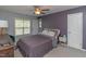 Stylish bedroom with modern decor, a window view, and comfortable furnishings at 121 Longleaf Pine St, Clayton, NC 27527