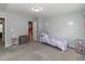 Bedroom featuring an ensuite bathroom and ample natural light at 121 Longleaf Pine St, Clayton, NC 27527
