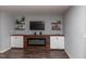 Cozy living room featuring a modern fireplace and built-in shelving for decor and media at 121 Longleaf Pine St, Clayton, NC 27527