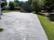 Wide paved driveway with ample space for parking and storage at 129 S Bullock St, Henderson, NC 27536