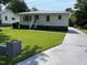 Charming home with a well-manicured lawn and inviting front entrance at 129 S Bullock St, Henderson, NC 27536