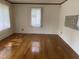 Hardwood floors and natural light in a spacious living room at 129 S Bullock St, Henderson, NC 27536