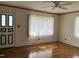 Hardwood floors and natural light in a spacious living room at 129 S Bullock St, Henderson, NC 27536