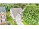 Aerial view of a two-story home showcasing its landscaped yard and neighborhood at 1304 Trailing Rose Ct, Wake Forest, NC 27587