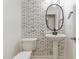 Modern powder room with patterned wallpaper, pedestal sink, and toilet at 1304 Trailing Rose Ct, Wake Forest, NC 27587