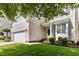Charming home with a well-manicured lawn, two-car garage, and inviting front porch at 1304 Trailing Rose Ct, Wake Forest, NC 27587