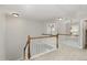 Hallway with white railings and neutral carpet at 1304 Trailing Rose Ct, Wake Forest, NC 27587