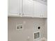 White laundry room with cabinetry at 1304 Trailing Rose Ct, Wake Forest, NC 27587