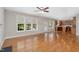 Open living space featuring hardwood floors, bright windows, and seamless flow to kitchen at 1304 Trailing Rose Ct, Wake Forest, NC 27587