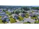 Aerial view of a home with a well-manicured lawn in a suburban neighborhood at 1305 Ivey Grove Ct, Fuquay Varina, NC 27526