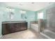 Bathroom featuring double sinks, a soaking tub, and a separate tiled shower enclosure at 1305 Ivey Grove Ct, Fuquay Varina, NC 27526