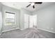Cozy bedroom with soft carpet, natural light from the window, and a closet at 1305 Ivey Grove Ct, Fuquay Varina, NC 27526