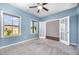 Well-lit bedroom with a ceiling fan and a view through the doorway to an adjacent room at 1305 Ivey Grove Ct, Fuquay Varina, NC 27526