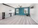Bonus room with plush carpeting, a mounted projector screen, and windows for natural light at 1305 Ivey Grove Ct, Fuquay Varina, NC 27526