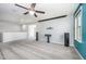Spacious bonus room featuring carpeted floors, a mounted projector screen, and neutral paint at 1305 Ivey Grove Ct, Fuquay Varina, NC 27526