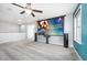 Home theater with projector screen, ceiling fan, and plush carpet at 1305 Ivey Grove Ct, Fuquay Varina, NC 27526