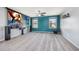 Spacious home theater with projector, screen, ceiling fan, and plush carpeting at 1305 Ivey Grove Ct, Fuquay Varina, NC 27526
