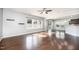 Bright living room with hardwood floors, recessed lighting, and large windows showcasing the spacious interior at 1305 Ivey Grove Ct, Fuquay Varina, NC 27526