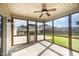 Inviting screened porch with a ceiling fan, offering a relaxing outdoor space at 1305 Ivey Grove Ct, Fuquay Varina, NC 27526