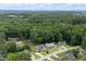 Aerial view of the home in a serene, tree-filled neighborhood, showcasing the property's setting at 1309 Sweet Charm Ln, Knightdale, NC 27545