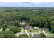 An aerial view shows the neighborhood's tree-lined streets and well-maintained homes at 1309 Sweet Charm Ln, Knightdale, NC 27545