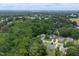 An aerial view reveals the neighborhood's canopy of mature trees and various home styles at 1309 Sweet Charm Ln, Knightdale, NC 27545