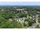 An aerial view shows well-kept homes surrounded by lush greenery, creating a serene neighborhood at 1309 Sweet Charm Ln, Knightdale, NC 27545