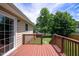 View of the property's back deck and its stained wood and view of the backyard at 1309 Sweet Charm Ln, Knightdale, NC 27545