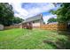 The backyard features a wood deck, a shed, and a wood fence for outdoor enjoyment and privacy at 1309 Sweet Charm Ln, Knightdale, NC 27545