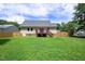 Expansive backyard featuring a deck, great lawn and wood fence at 1309 Sweet Charm Ln, Knightdale, NC 27545