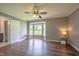A sun-filled bedroom with a bay window and ceiling fan, creating a cozy and inviting space for relaxation at 1309 Sweet Charm Ln, Knightdale, NC 27545