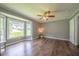 Cozy bedroom showcases a bay window and fan, providing comfort and a serene atmosphere for relaxation at 1309 Sweet Charm Ln, Knightdale, NC 27545