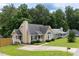 Well-maintained home featuring a classic design, lush lawn, and a welcoming front porch at 1309 Sweet Charm Ln, Knightdale, NC 27545