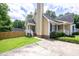 Charming home with a manicured lawn, classic siding, and a welcoming entryway with white trim at 1309 Sweet Charm Ln, Knightdale, NC 27545