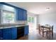 This is a kitchen showing an eat-in kitchen area, stainless sink, granite counters, and a door that leads to the deck at 1309 Sweet Charm Ln, Knightdale, NC 27545