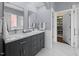 Elegant bathroom with double vanity, marble countertop, tile accents and open closet at 1330 Rodessa, Raleigh, NC 27607