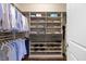 Walk-in closet with custom shelving, shoe racks, and drawers for optimal storage and organization at 1330 Rodessa, Raleigh, NC 27607