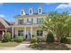 Charming two-story home with yellow siding, dormer windows, and a covered front porch at 1330 Rodessa, Raleigh, NC 27607