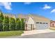 This garage features an automatic door, walkway, manicured lawn, and fence at 1330 Rodessa, Raleigh, NC 27607