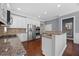 Modern kitchen featuring granite countertops, stainless steel appliances, and white cabinets at 1330 Rodessa, Raleigh, NC 27607