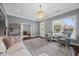 Elegant living room with hardwood floors, decorative chandelier, and large windows at 1330 Rodessa, Raleigh, NC 27607