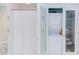 Practical bathroom featuring laundry facilities near a tub and shower area at 1405 Pennsylvania Ave, Durham, NC 27705