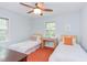 Charming bedroom featuring two beds, stylish decor, and natural light at 1405 Pennsylvania Ave, Durham, NC 27705