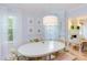 Charming dining room with an oval table, bright natural light, and stylish decor at 1405 Pennsylvania Ave, Durham, NC 27705